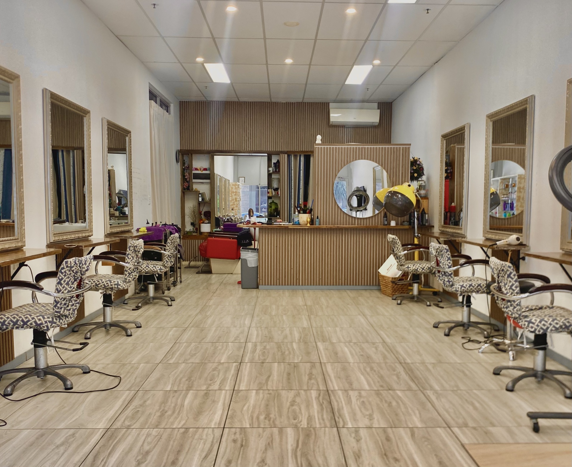 Interior of An&Mei Hair Salon Kogarah — premium styling stations with warm gold accents